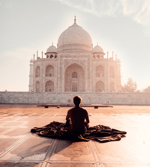 A Boy Meditating In Front Of Taj Mahal