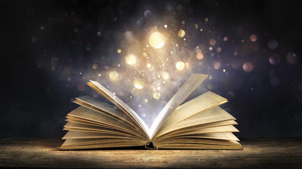 Magical book with glowing lights and sparkles.